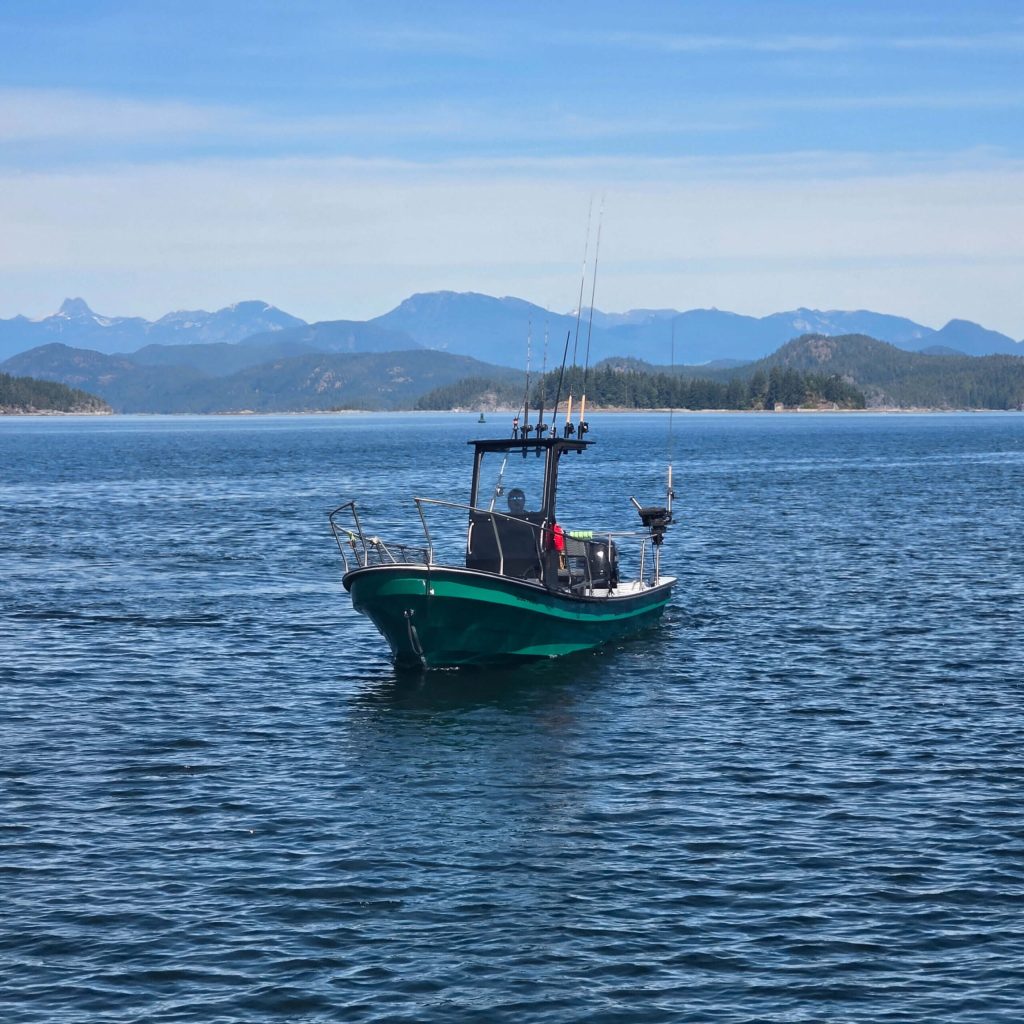 The Fierce Fish boat out on the open water between Quadra Island and Campbell River on a fishing charter tour.